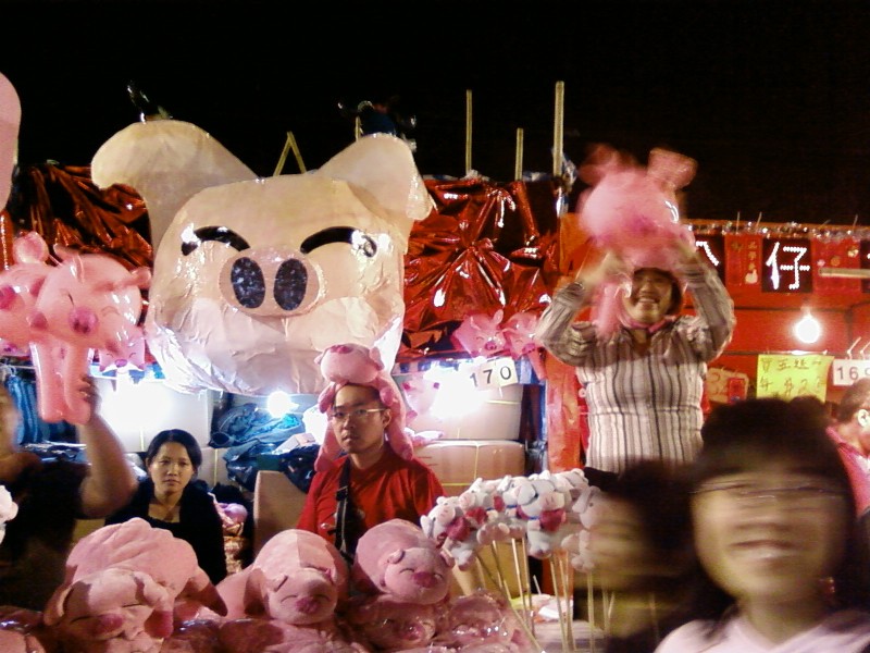 pig hats and unenthused vendor guy